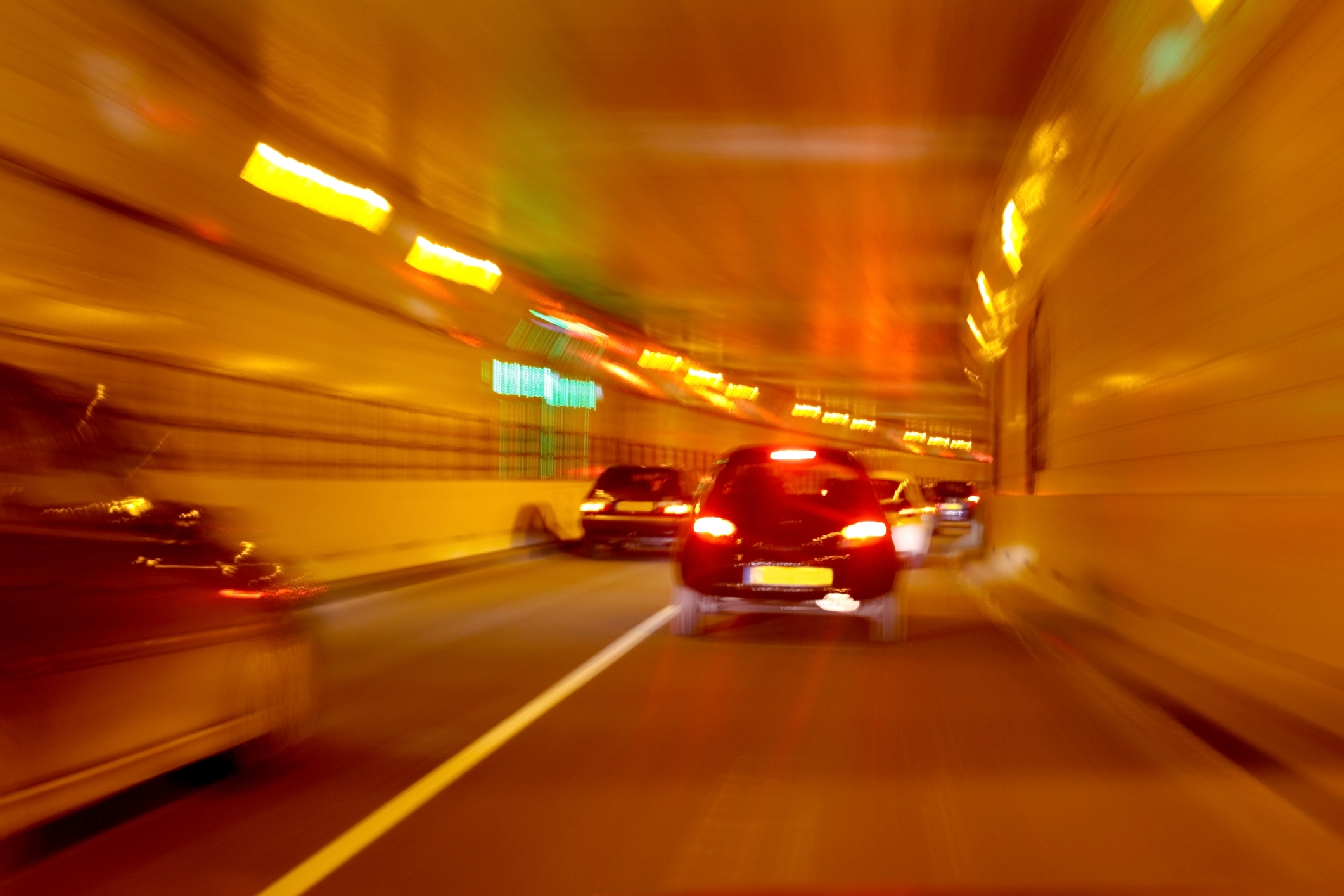 blurred cars in tunnel lights